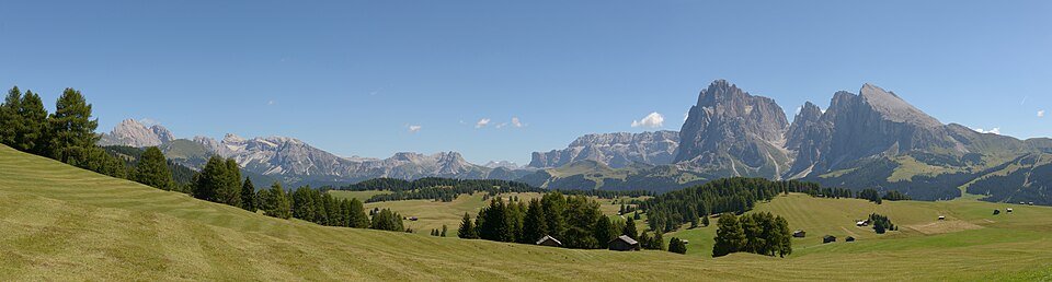 The Alpe di Siusi high alpine meadow with the Sassolungo and Odle mountains in the background, Val Gardena, Dolomites